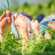 children's feet in the grass